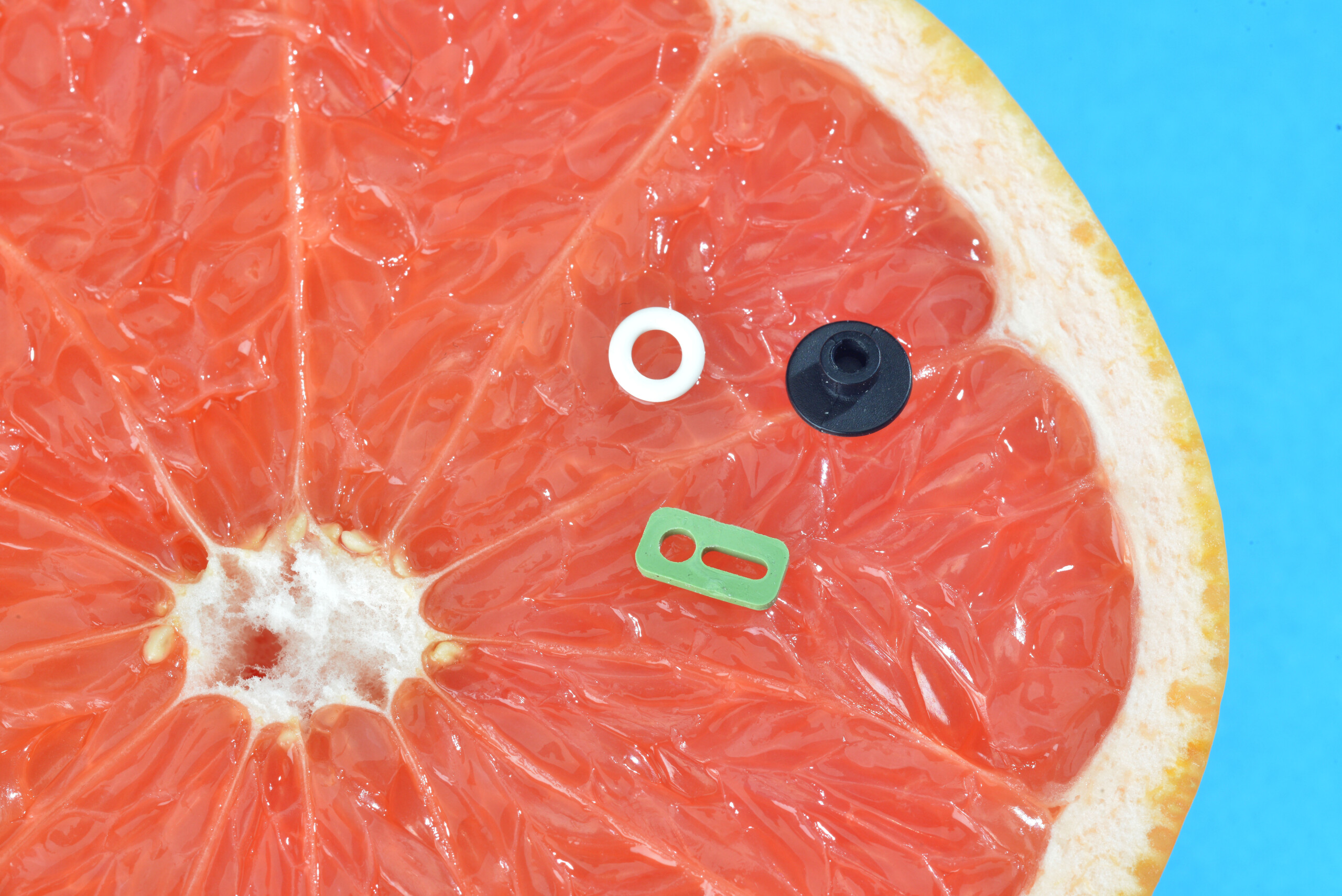 A selection of MicroFORM micro seals pictured on a grapefruit for scale