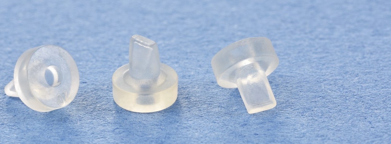 A series of three duckbill valves on a blue background